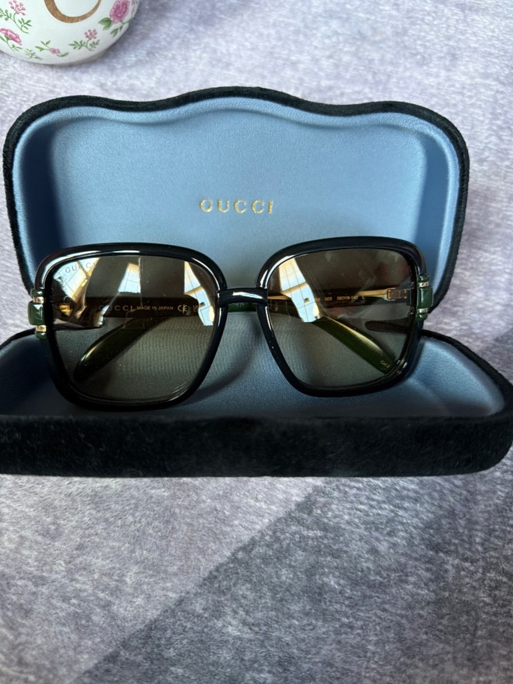 Gucci sunglasses green and gold